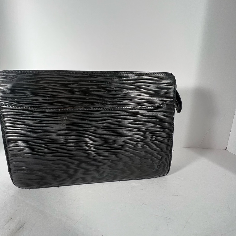 Vintage Louis Vuitton clutch in Black Epi leather.
